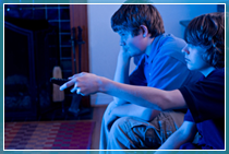 Children playing games consoles