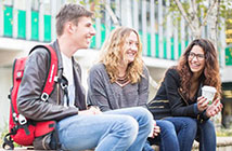 three students talking